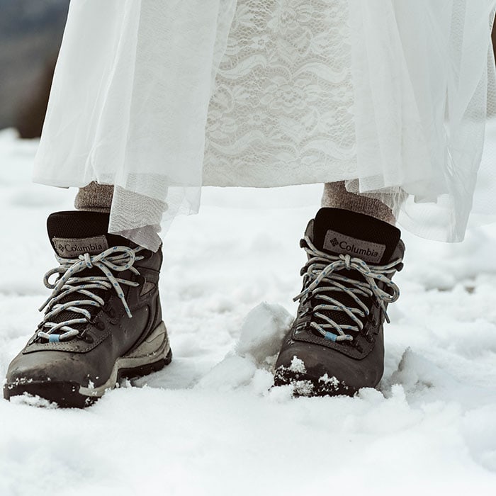 Elopement photographer - a bride's feet, walking in the snow