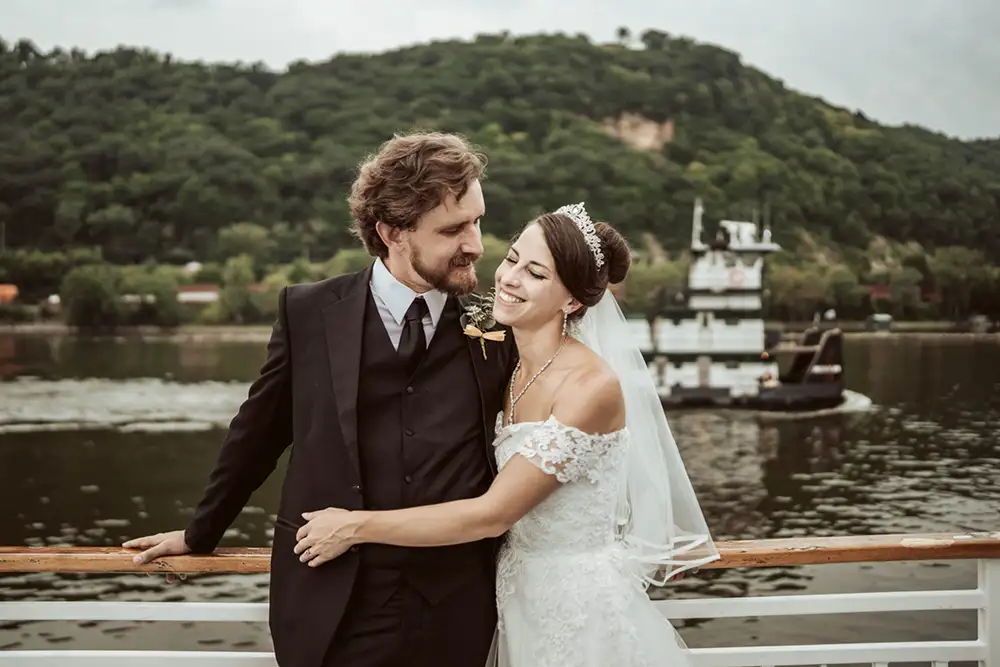 A bridge and groom on a boat cruise elopement, photographed on the Mississippi River in August 2022 by Rachel Sue Photography