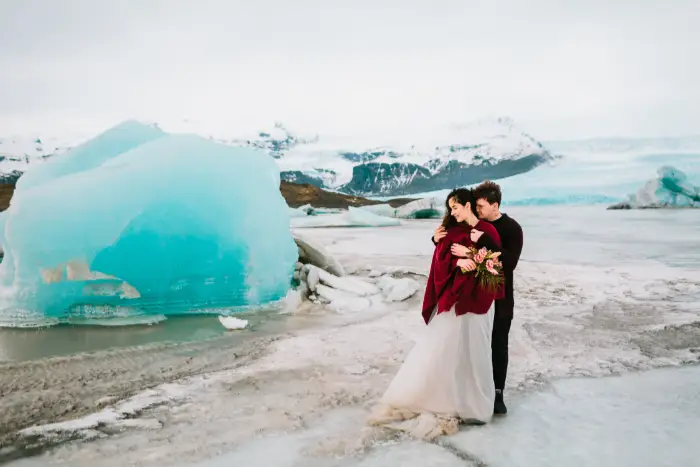 A newlywed couple who eloped to Glacier Lagoon in Iceland